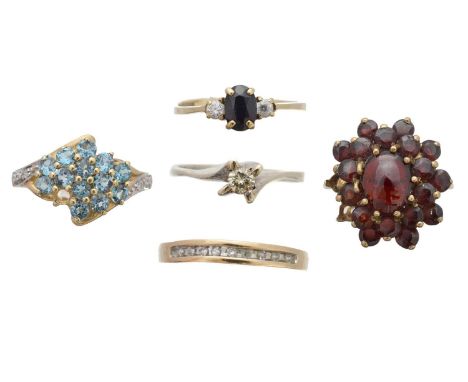 Five 9ct gold gem-set dress rings, to include a diamond single-stone ring, a diamond band ring, a blue topaz and diamond clus