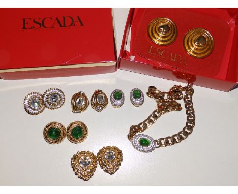 A boxed pair of large Escada gilt layered disc earrings, a pair of Butler &amp; Wilson heart shaped earrings, a pair of Chris