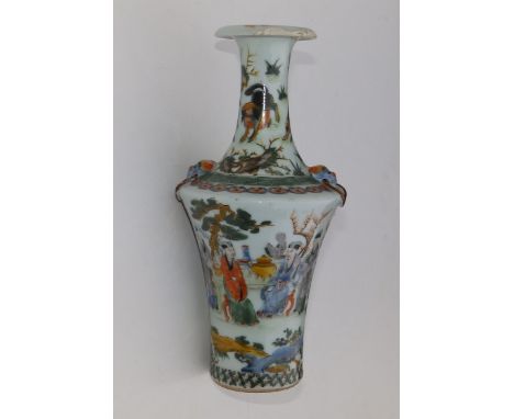 A Chinese famille verte porcelain bottle vase, the angular shoulders moulded with lion mask ring handles, the narrow waisted 