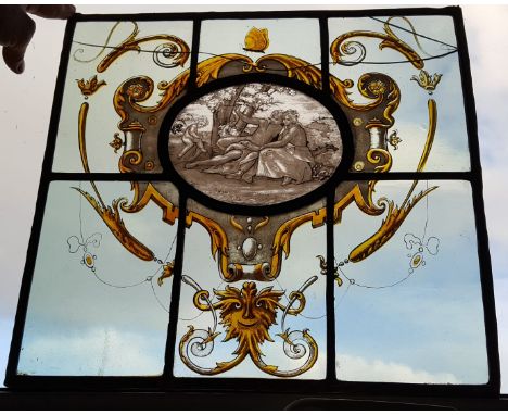 A stained glass leaded light panel, decorated with a courting cuple in Renaissance Revival taste, 16" x 15.5".
