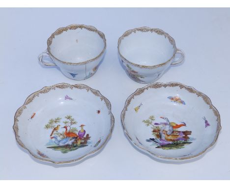Two German porcelain teacups and saucers, painted polychrome exotic birds &amp; butterflies in 18thC taste, Meissen reject ma