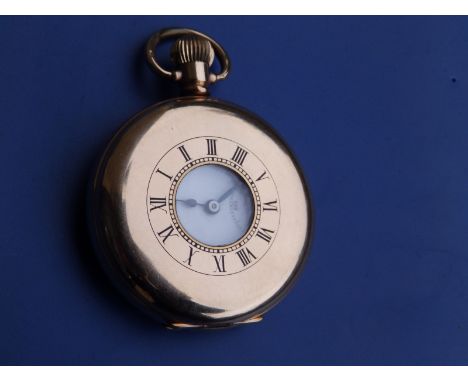 A gold plated half hunter pocket watch by Tavannes Watch Co. in Dennison case.