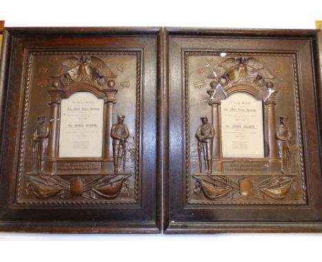 A pair of WWI bronzed plaster plaques commemorating the loss of two brothers from the Spearing family, serving in the Somerse