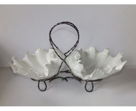 A matched pair of Royal Worcester Grainger &amp; Co. white moulded porcelain shell baskets on EP stand, each bowl 6.8" across