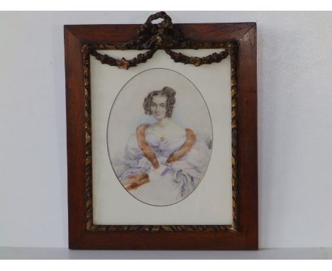 Francois Rochard - a small oval watercolour portrait of a young lady with fur stole, 7.25" high, in rosewood frame with festo