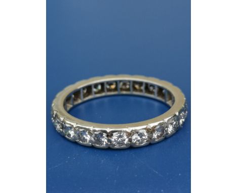 A diamond set 18ct white gold eternity ring.  Finger size Q/R.