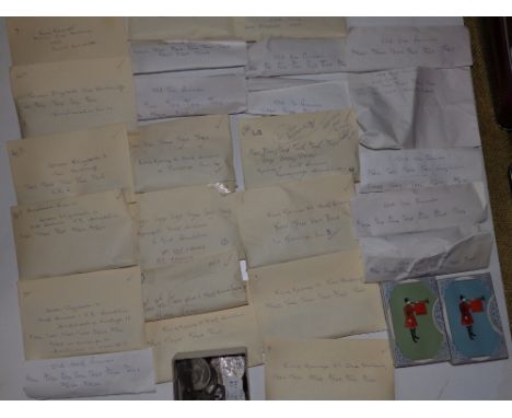 A large collection of early 20thC GB coins, mostly in listed envelopes, together with two unopened packs of De La Rue playing