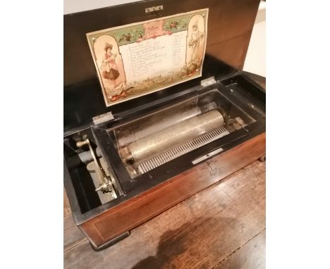 A 19thC Swiss cylinder musical box retailed by List Thellung &amp; Staffauch, Zurich, in marquetry case,  playing 12 airs on 