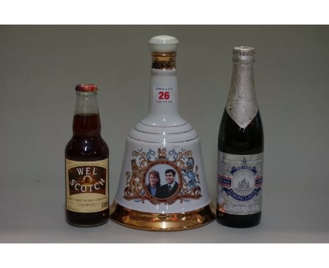 A 75cl bottle of Bell's blended whisky, commemorating Prince Andrew's wedding, in Wade decanter; together with a 33cl bottle 