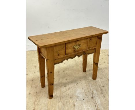 A neat rustic pine console table with single drawer, on shaped tapered supports (h.80cm x l.102cm x w.36cm)