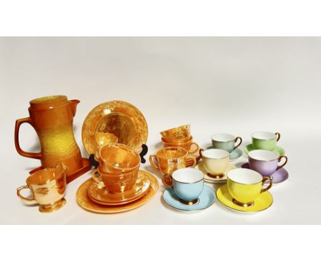 A Collingwood pastel colour six-part tea cup set comprising of sky blue, lilac etc. together with a Fire King orange Lustre p