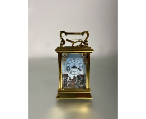 A Halycon Days brass carriage clock with enamel dial "The Eastgate Clock Chester" limited edition no. 26 with key (h.with han