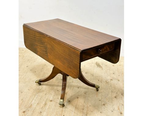 A 19thc mahogany drop leaf sofa table with frieze drawers to each side, on bipod supports, with paw feet, caps and castors (h