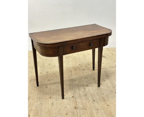 A 19thc mahogany demi lune inlaid foldover card table with drawer to front, with baize to interior, on square tapered support