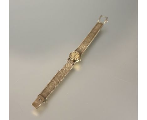A 9ct gold ladys Omega manual wind wrist watch on milanaise 9ct gold fixed strap not working, strap a/f 22.56g