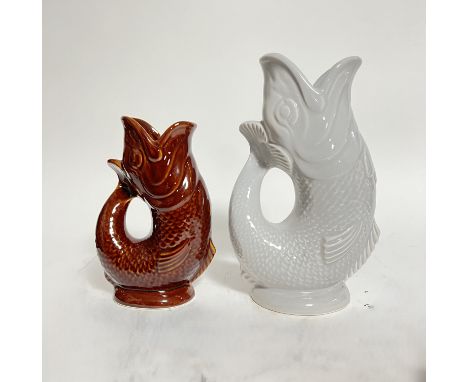A collection of two Darthmouth pottery gluggle jugs, one light grey glazed jug (h-25cm) the other a brown glazed jug (h-18cm)