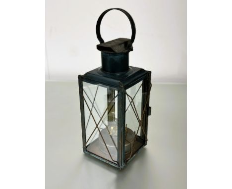 A vintage toile lantern parafin light loop handle to top and glazed sides and dark green painted finish: h. x 50cm w. x 9cm s
