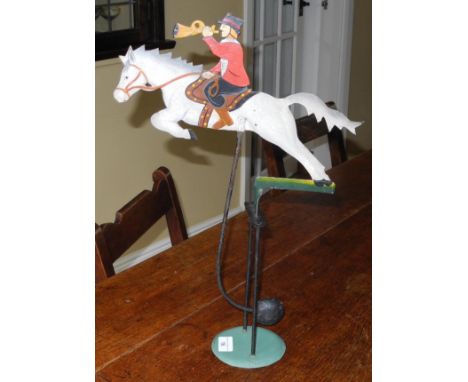 A contemporary tin automaton, in polychrome,  of a huntsman on a grey horse, 47cm high 