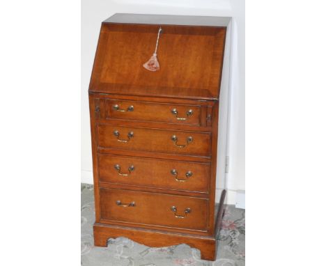 A mid 20th century walnut bureau, fall front with four cockbeaded drawers, bracket feet, 98cm high, 64cm wide 