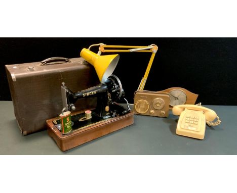 A vintage Singer hand operated sewing machine, cased;  a 1960's Decca portable radio, angle poise lamp, 1980's cream Push but