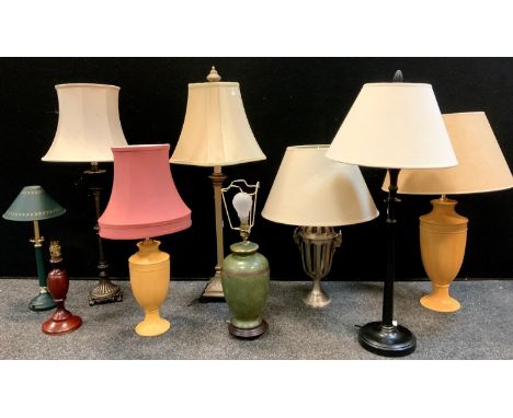 A Gothic revival cast metal table lamp, with Rams head masks, others neoclassical, pair of graduated wooden urn lamps, etc (9