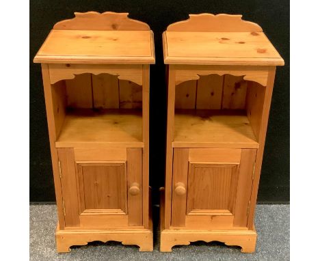 A pair of pine bedside cabinets, open shelf above panelled door (2) 