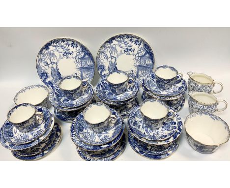 A Royal Crown Derby Mikado blue pattern twelve setting tea service inc bread plates, cups, saucers, side plates, milk jugs et