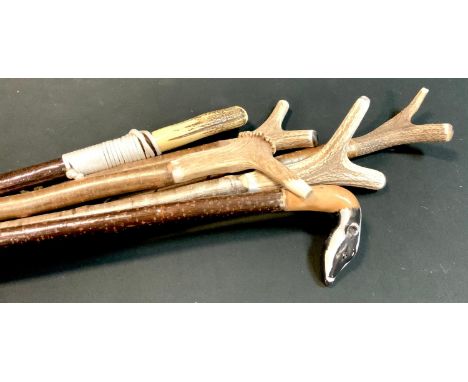 Walking Sticks - A carved Badger head walking stick, others including thumb sticks, antler handled, tallest 168cm (6) 