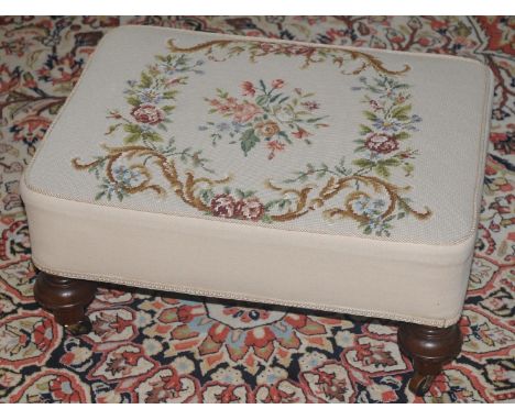 A 20th century rectangular foot stool, tapestry top, turned legs, 58cm wide, 30cm high 