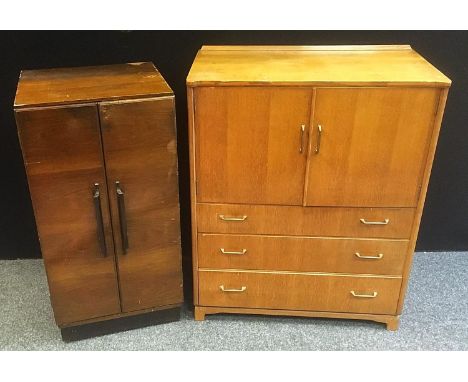 A Lebus Link light oak tallboy, pair of plain panel doors over three graduated drawers, 95.5cm x 77cm ;  a smaller two door c