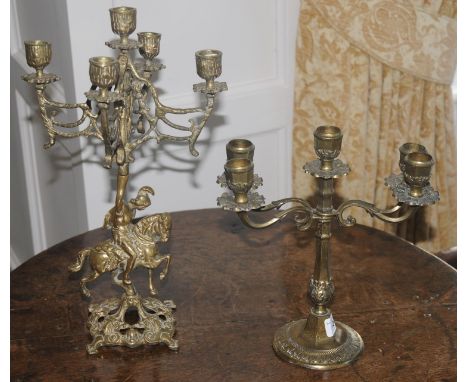 A brass five light candleabrum, the base case with knight on horseback, 37cm high;  another (2) 