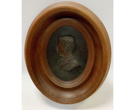 An early 20th century relief bronzed metal portrait plaque inscribed Amaut, 18cm x 13cm, framed 