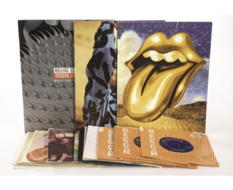 Rolling Stones: A collection of eighteen 7” vinyl singles plus three tour programmes  