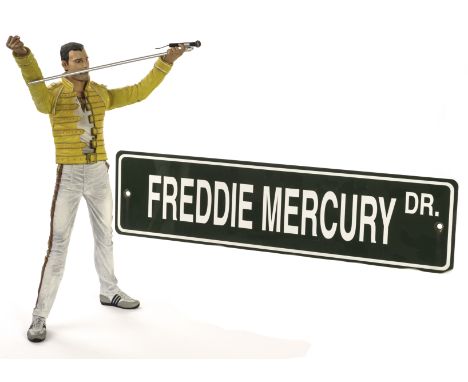 Queen: mixed collection of memorabilia including five DVDs, twelve videos, three mugs, six badges, ten books, reproduction ro
