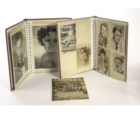 Film Stars And Entertainers: two albums of vintage promo photographs and cards including Ginger Rogers, Laurence Olivier, Ron
