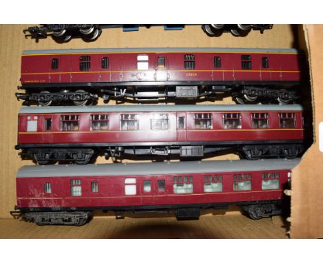 Group of three 00 gauge coaches in red livery to include Triang and Lima