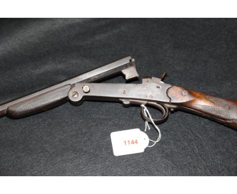 SHOTGUN: a Belgian folding single barreled .410 with external hammer, repaired at the hand, no visible number