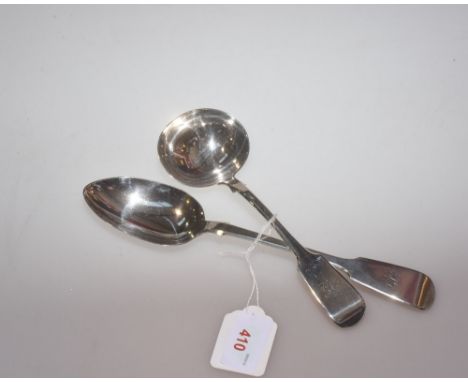 A Victorian silver fiddle pattern serving spoon, London 1863, tog with a similar patterned sauce ladle, London 1861, each bea