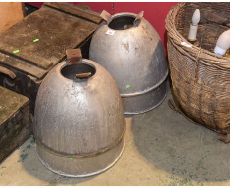 A set of four industrial mirrored light shades