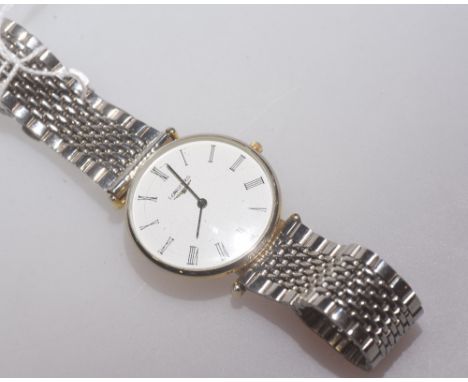 A gent's wristwatch, the white enamel dial with Roman numerals and signed Longines with bracelet strap
