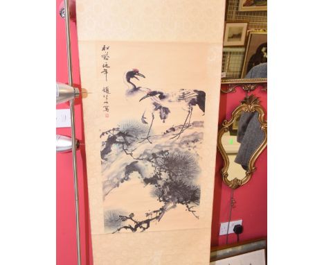 A Chinese print of cranes on a silkwork scroll