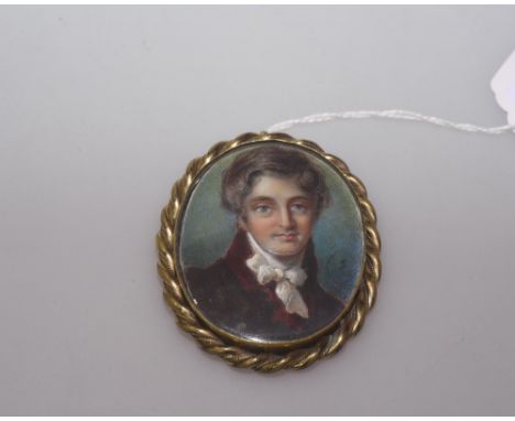 A 19th century portrait miniature of a gentleman on ivory in gilt metal frame with an attractive agate back, 7cm by 5.5cm inc