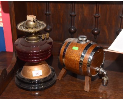 An oak barrel form decanter; tog. with a Victorian oil lamp with a ruby glass reservoir