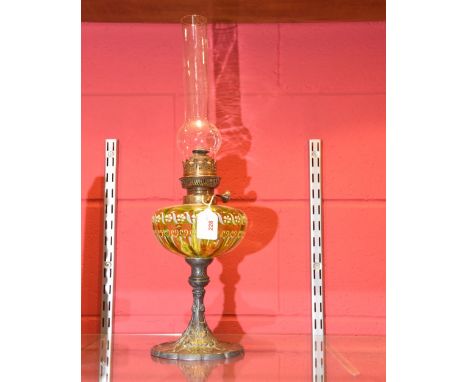 A late 19th century oil lamp, with enamel decorated green glass reserve on an ivy leaf moulded pewter base, stamped 78 mark t