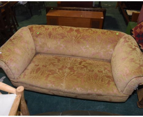 A two seater sofa of Chesterfield type