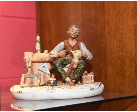 A Capodimonte figure of a puppet maker