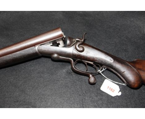 SHOTGUN: A William Evans 12 gauge side by side hammer gun, with under lever action and straight hand stock, No. 1712