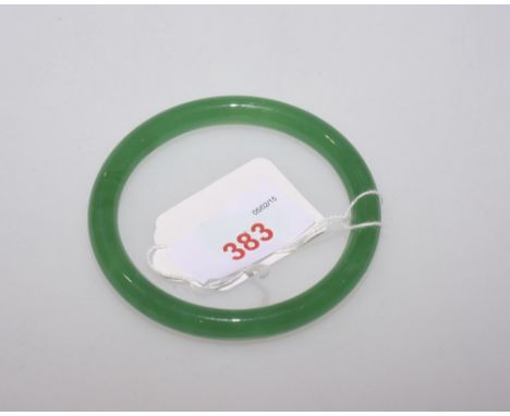 A Chinese jadeite bangle, approx. 36 grams 