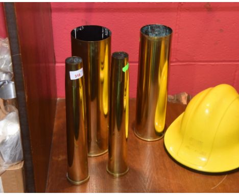 Four post WW11 brass ammunition shell casings