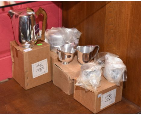 A vintage Picquot ware tea set comprising hotwater jug, cream jug and sugar bowl and teapot (unused and with original boxes) 